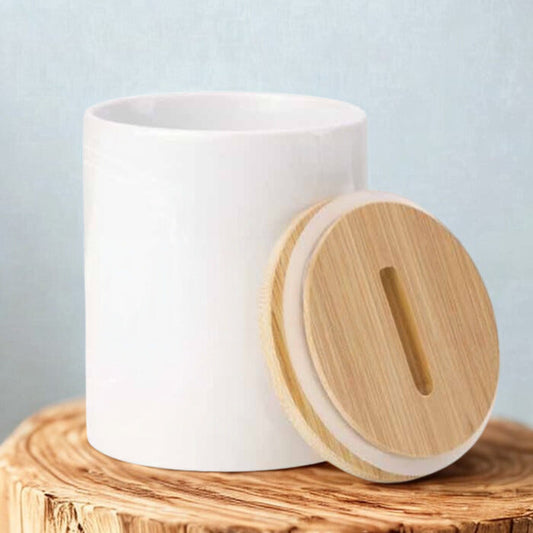 White ceramic jar with a wooden lid on a wooden block against a light blue background